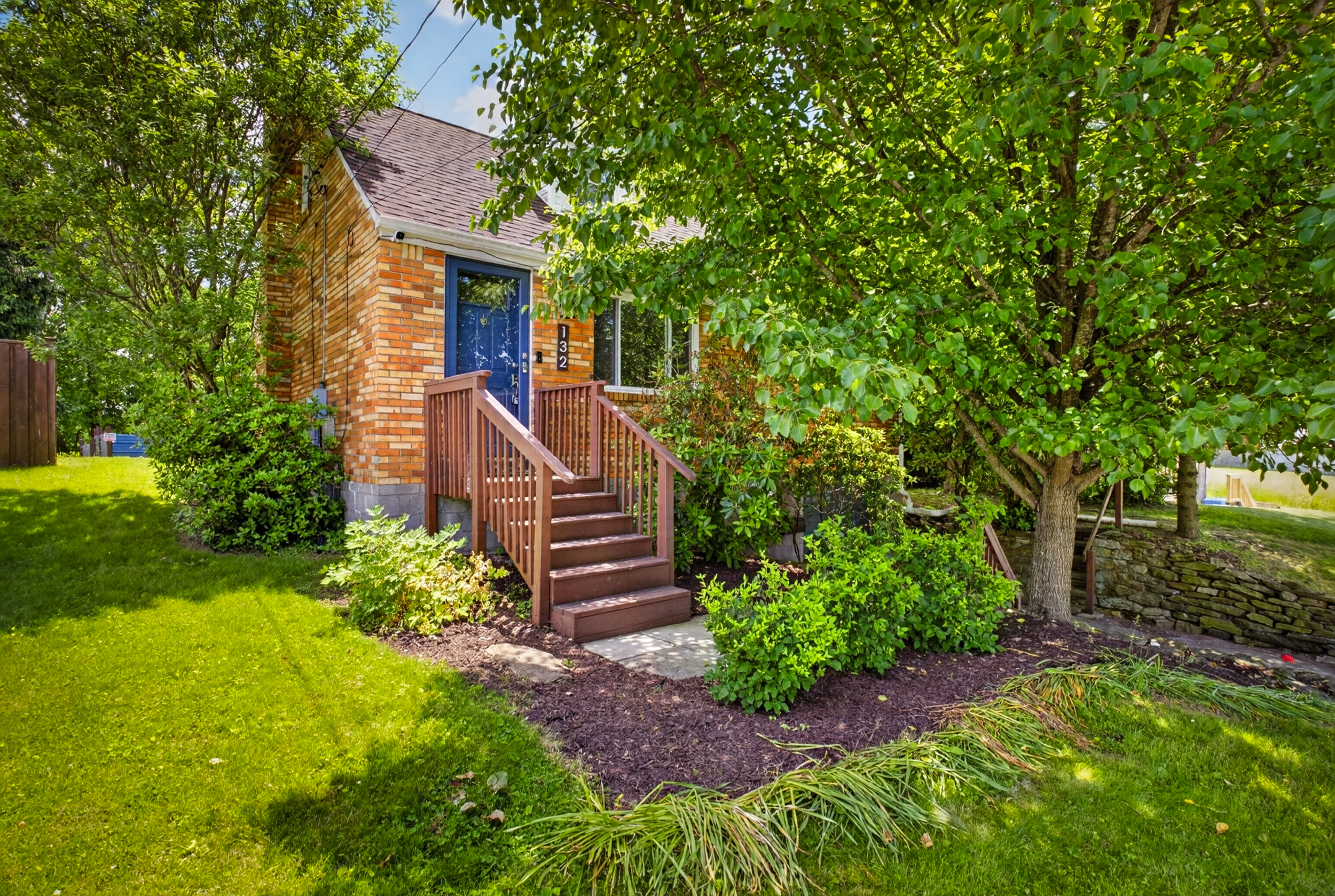 Updated 3-bedroom Cape Cod home for sale in Penn Hills with private wooded backyard