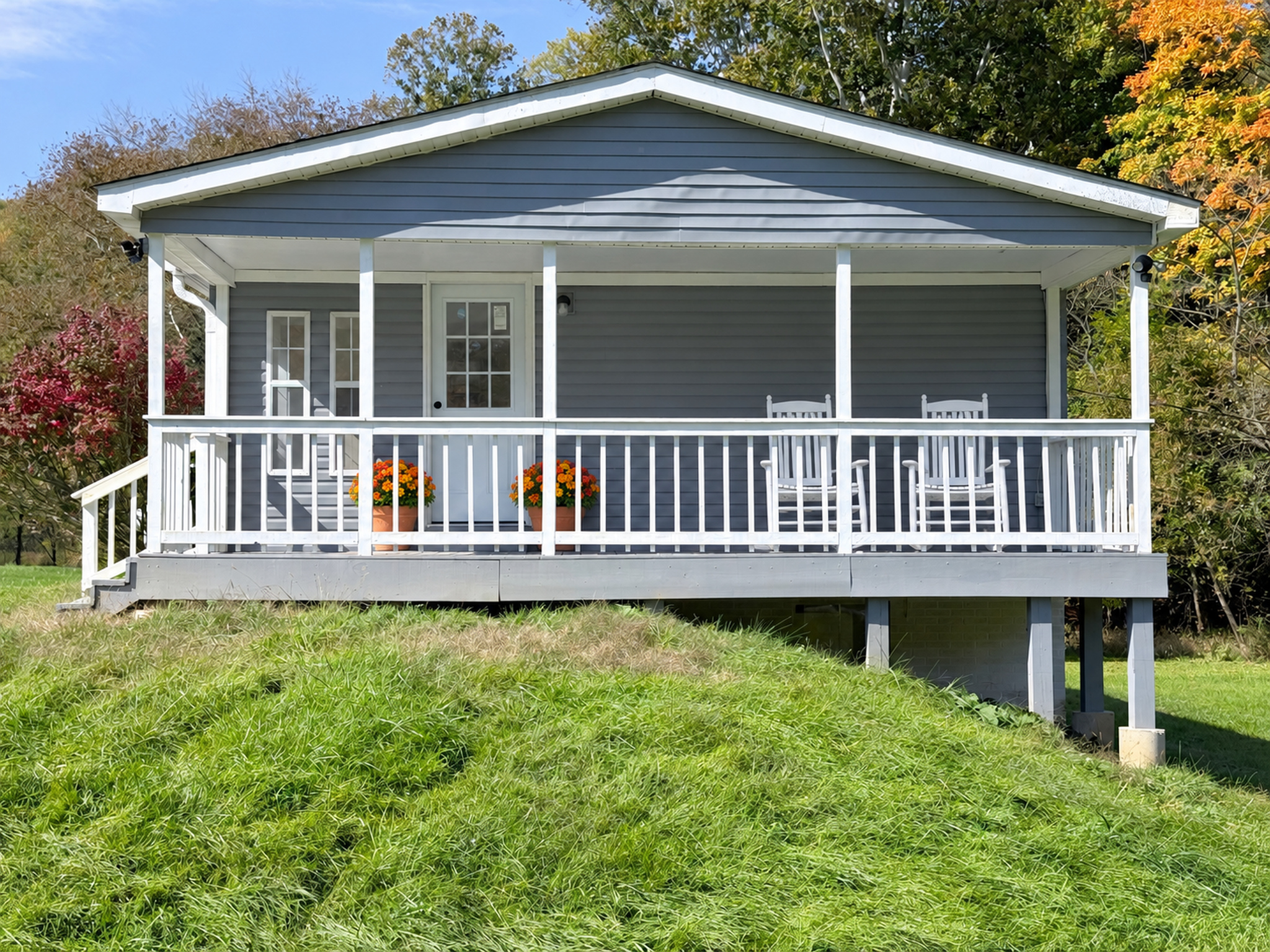 Covered porch at 120 Blythe Road, virtually staged.