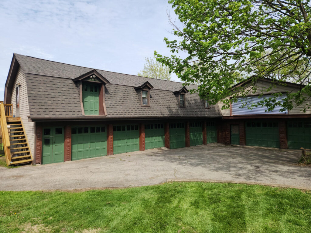 Exterior of 27 Richmond Street in Crafton, Pennsylvania, featuring a residence with multiple garages.